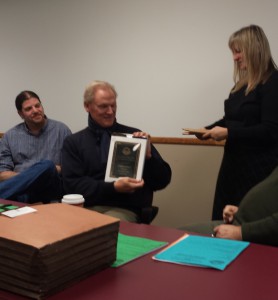 President Graydon Royce receives a plaque from his successor, Janet Moore, at the Dec. 9 Membership Meeting.